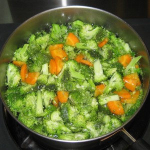 Blanch the broccoli and carrots in water to cover