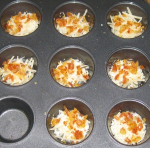 Arrange the cheese and bacon into prepared muffin cups