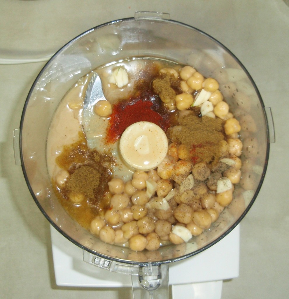 Place all of the ingredients into the bowl of a food processor and process until very smooth